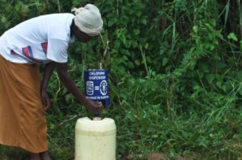 A person using a Chlorind Dispenser