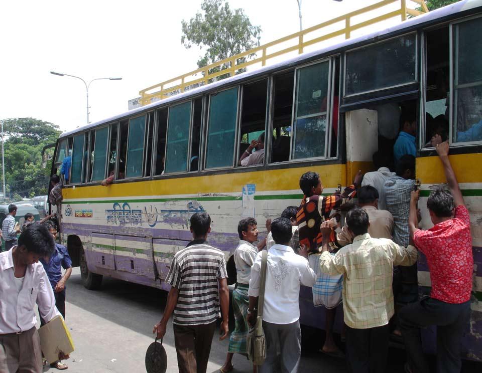 Migrants board a bus in Bangladesh Migrants board a bus in Bangladesh